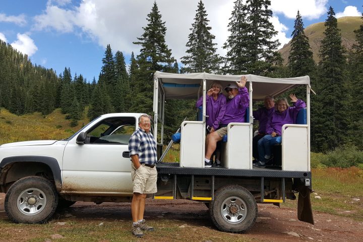 a person riding on the back of a truck
