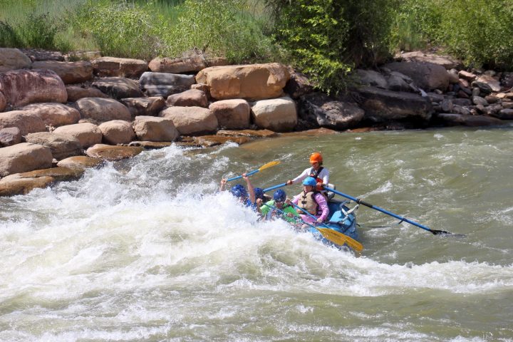 a group of people riding skis on a body of water