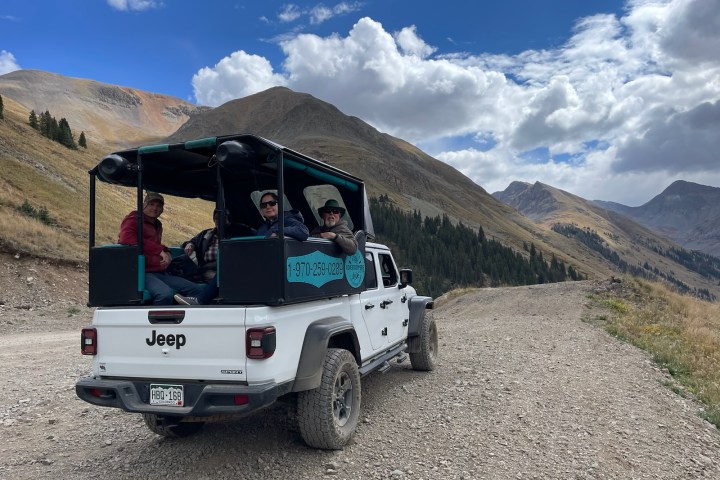 a truck with a mountain in the background